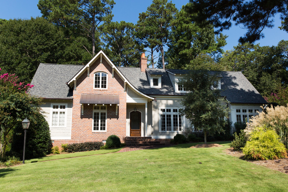 Inspiration for a large beige two-story wood gable roof remodel in Atlanta