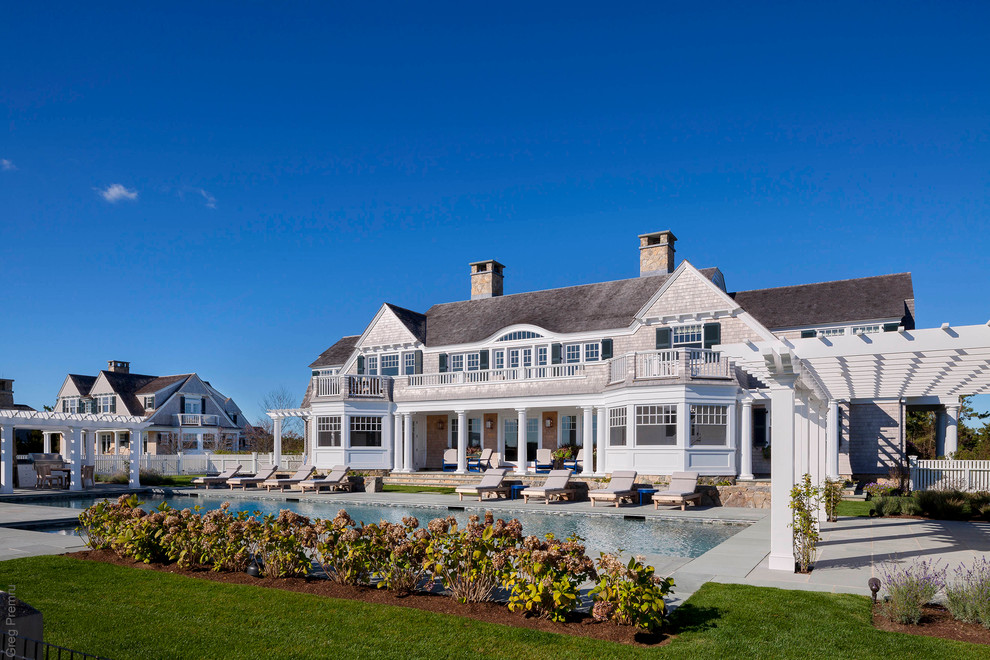 This is an example of a large coastal two floor house exterior in Boston.