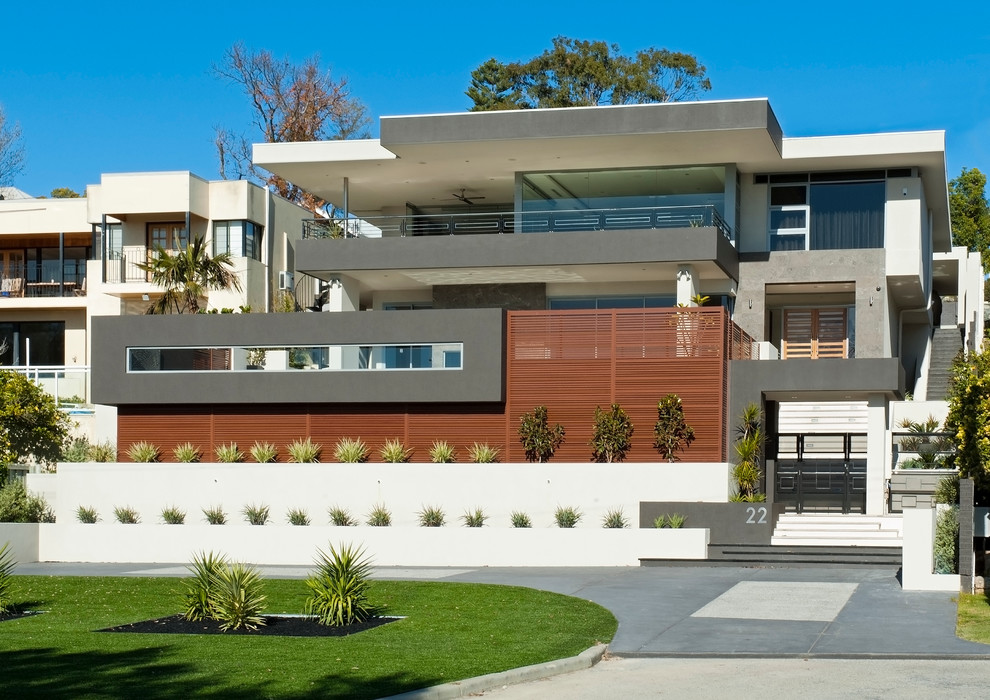 This is an example of an expansive contemporary house exterior in Perth with three floors and a flat roof.