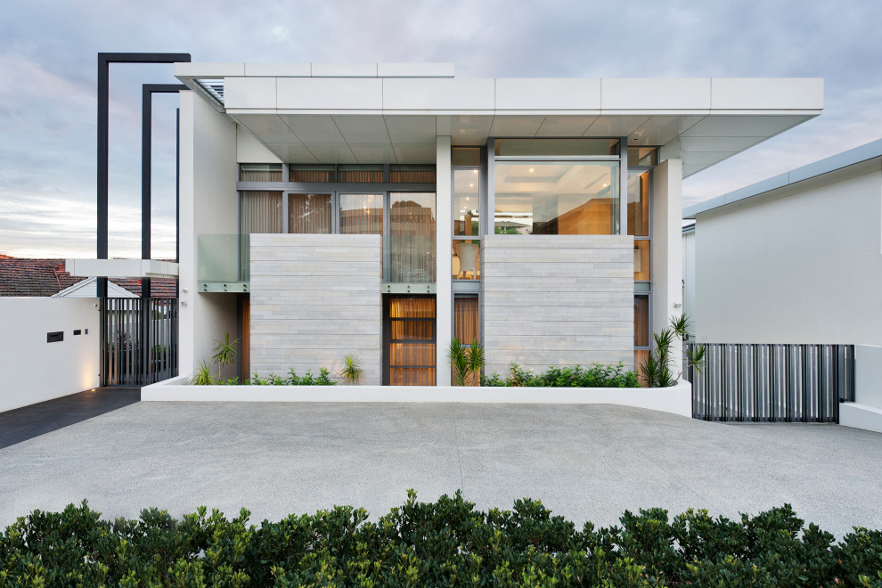 Inspiration for a large contemporary white two-story exterior home remodel in Perth