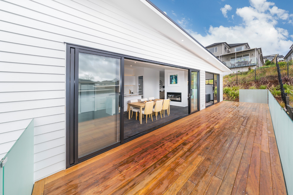 Large and brown modern two floor house exterior in Auckland with vinyl cladding.