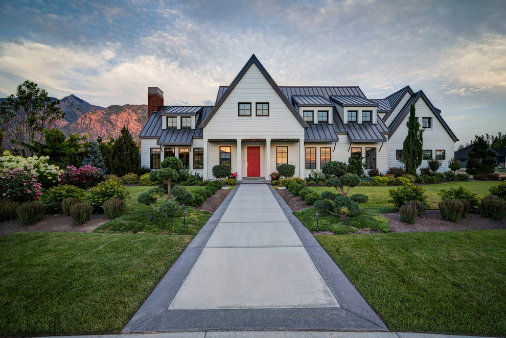 Inspiration for a white rural two floor house exterior in Salt Lake City with a pitched roof.
