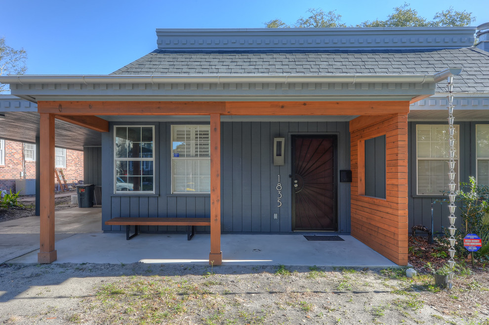 Small transitional gray one-story wood house exterior photo in Jacksonville with a shed roof and a shingle roof