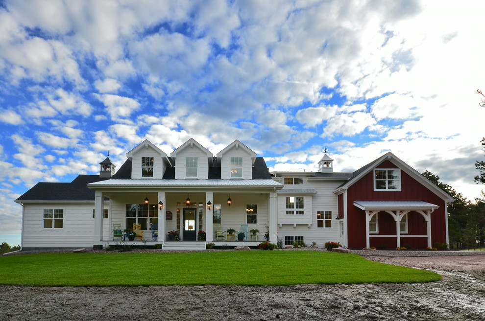 Large farmhouse white two-story gable roof idea in Cleveland