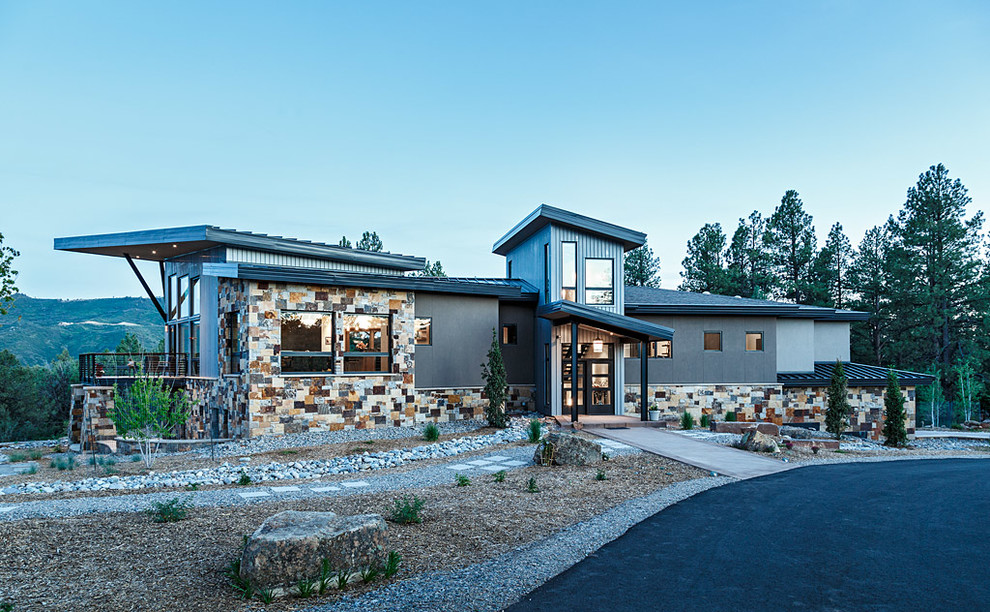Beige and large contemporary two floor house exterior in Denver with mixed cladding and a lean-to roof.