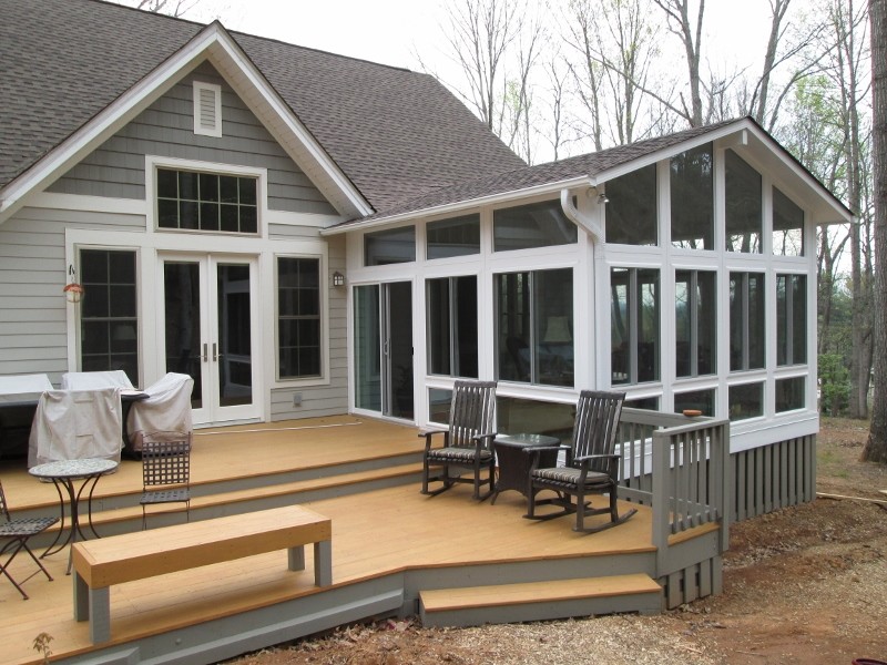 Example of a large classic gray one-story mixed siding exterior home design in Other with a shingle roof