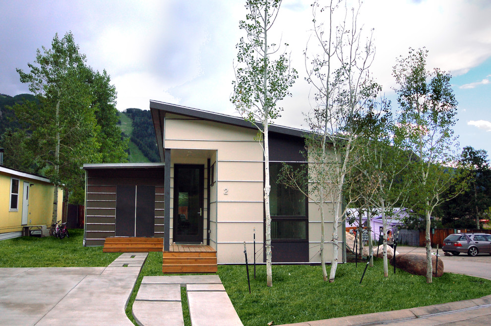 Photo of a contemporary bungalow house exterior in Denver with mixed cladding.