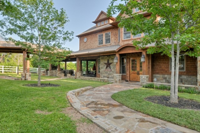Example of a mountain style exterior home design in Dallas