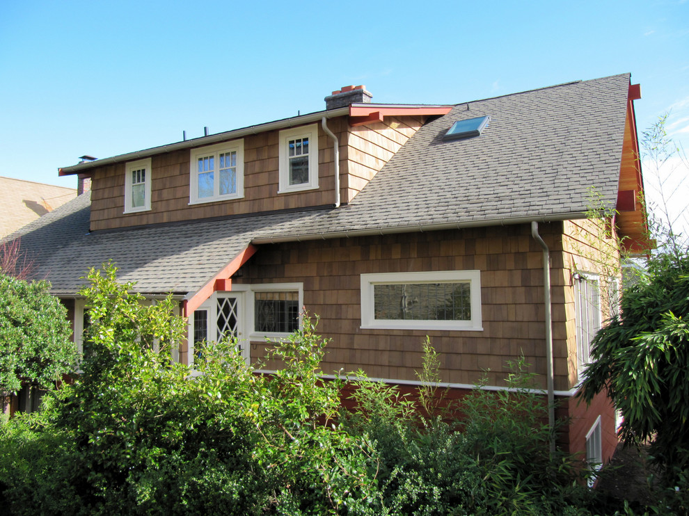 Mid-sized arts and crafts beige two-story mixed siding gable roof photo in Seattle
