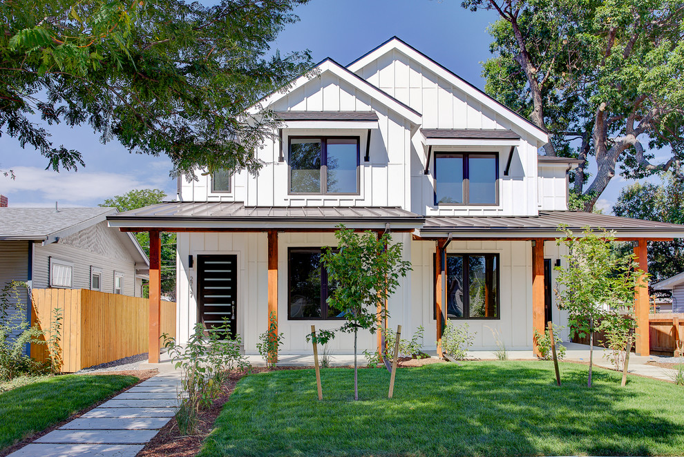 Example of a transitional white two-story wood exterior home design in Denver