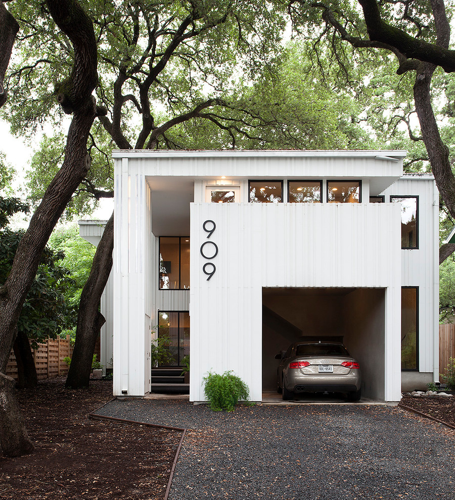 Photo of a white midcentury two floor detached house in Austin.