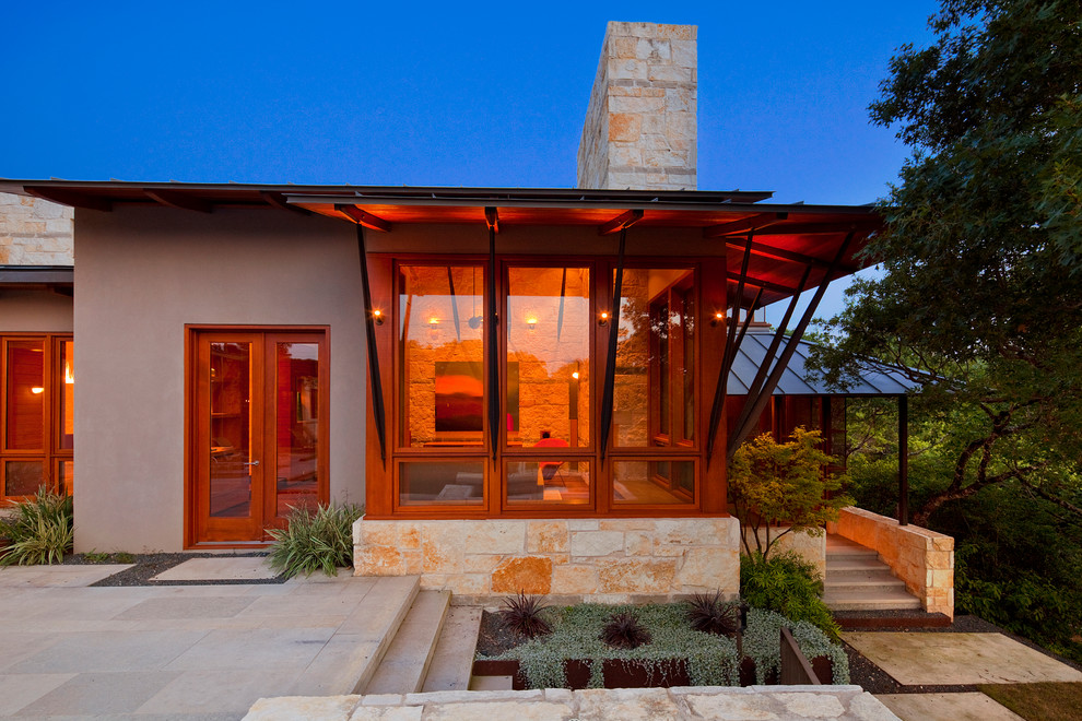 Photo of a contemporary bungalow house exterior in Austin.