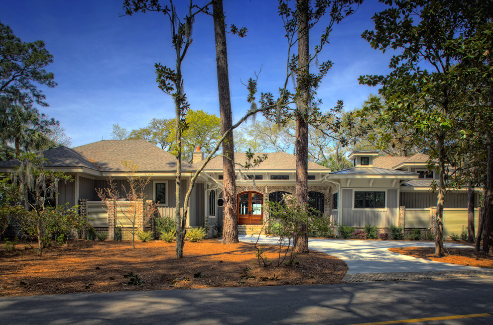 Photo of a large and beige nautical bungalow house exterior in Charleston.