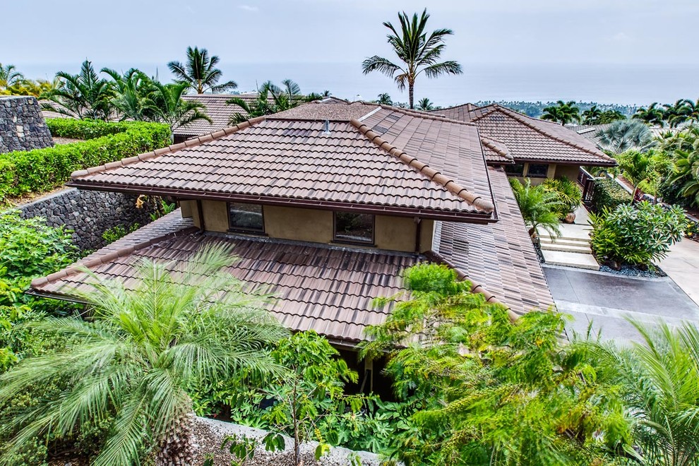 Photo of an expansive world-inspired two floor render house exterior in Hawaii.