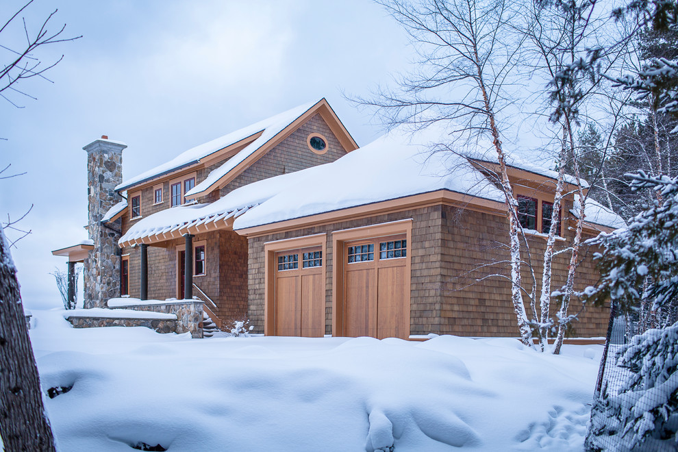 Inspiration for a rustic brown two-story wood exterior home remodel in Other