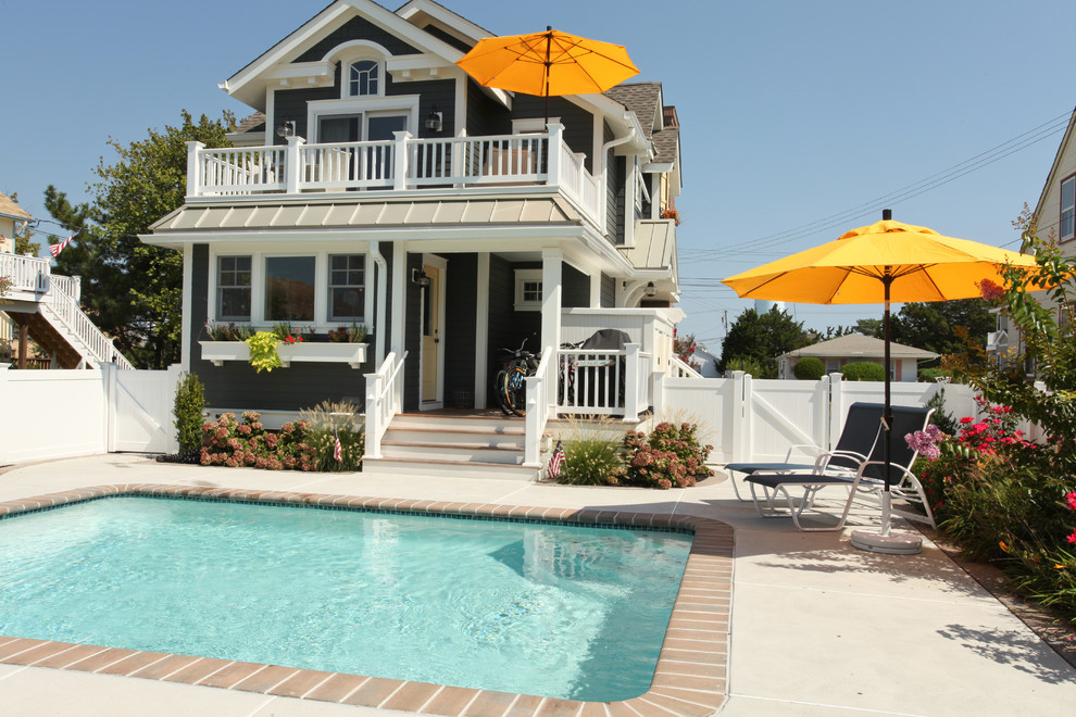 Small coastal two-story exterior home idea in Philadelphia