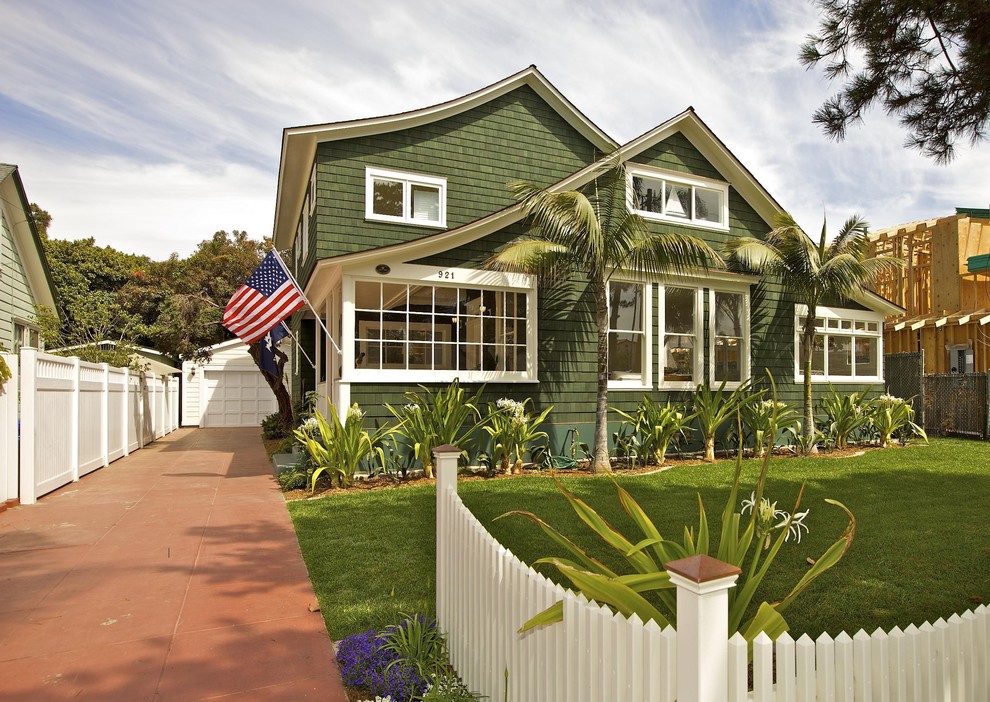 Beach style green two-story wood exterior home photo in San Diego