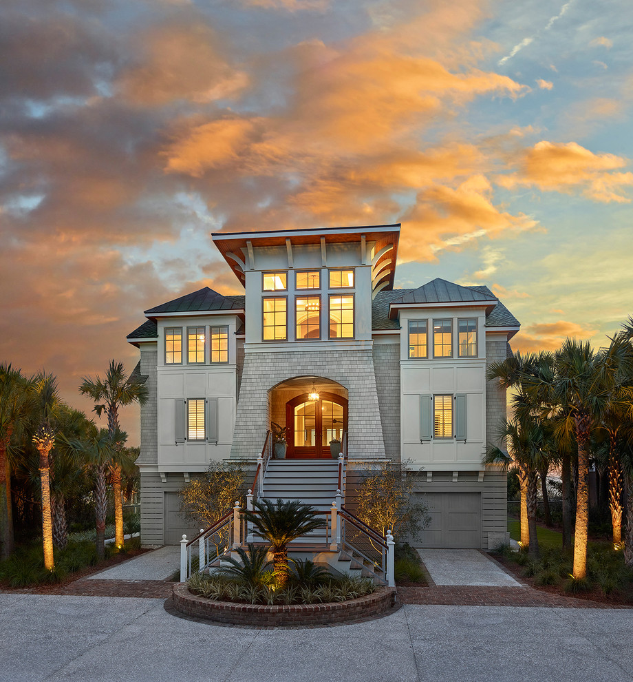 Example of a beach style mixed siding exterior home design in Charleston