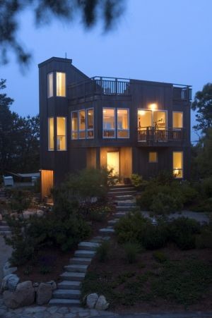 Inspiration for a small coastal beige three-story wood exterior home remodel in Boston