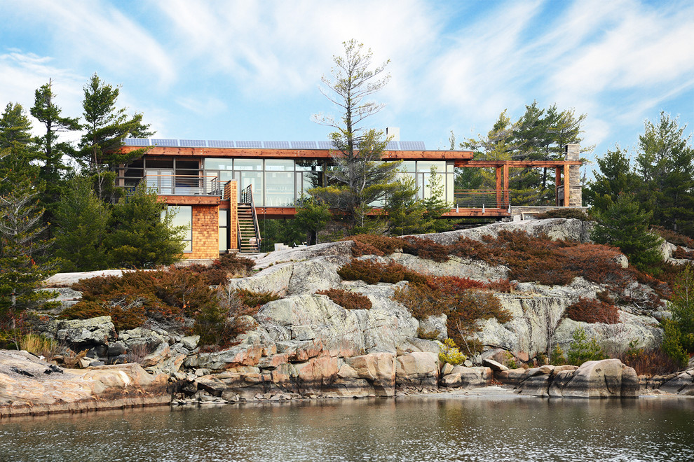 Inspiration for a coastal glass exterior home remodel in Toronto