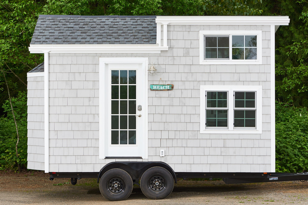 Beach style gray two-story wood gable roof photo in Portland