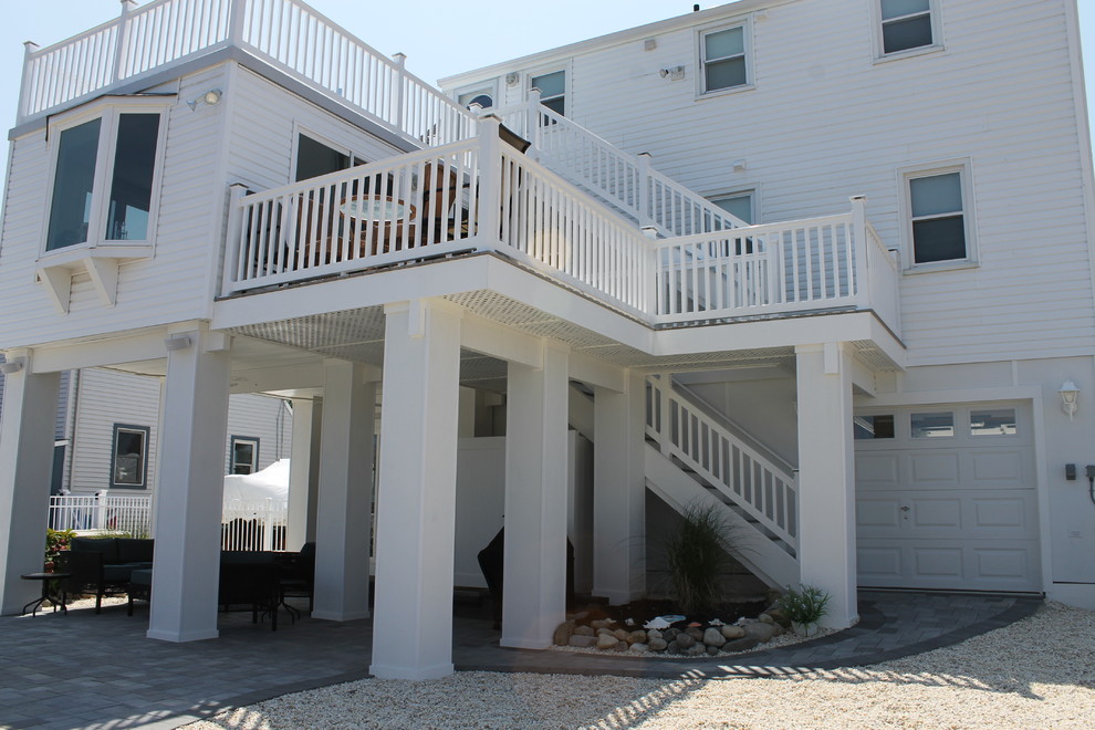 Example of a mid-sized beach style exterior home design in New York