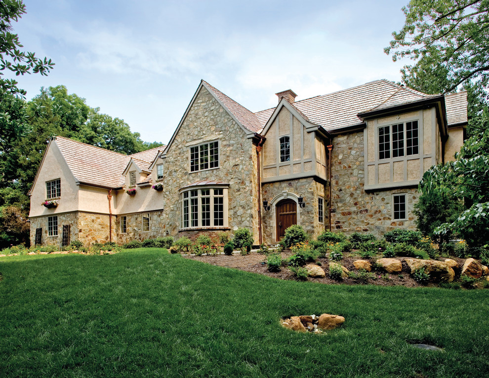 Elegant two-story stone exterior home photo in Philadelphia