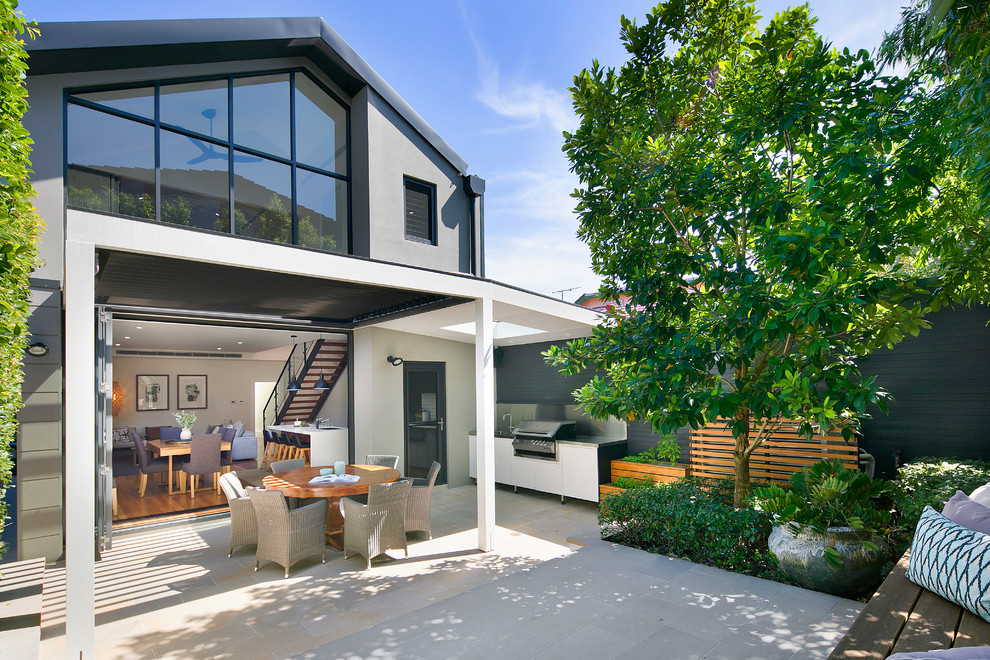 Photo of a brown contemporary two floor brick detached house in Sydney.