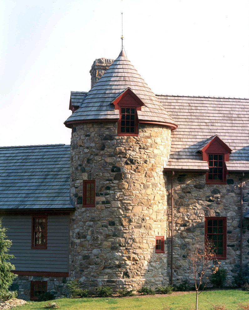 Design ideas for a farmhouse house exterior in Philadelphia with stone cladding.