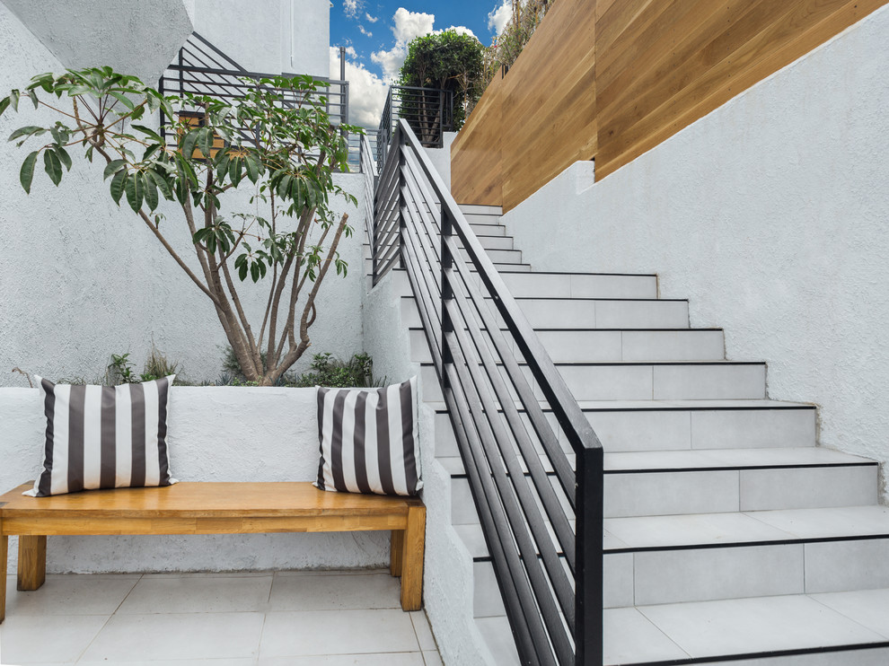 Inspiration for a huge 1950s white two-story stucco exterior home remodel in Los Angeles