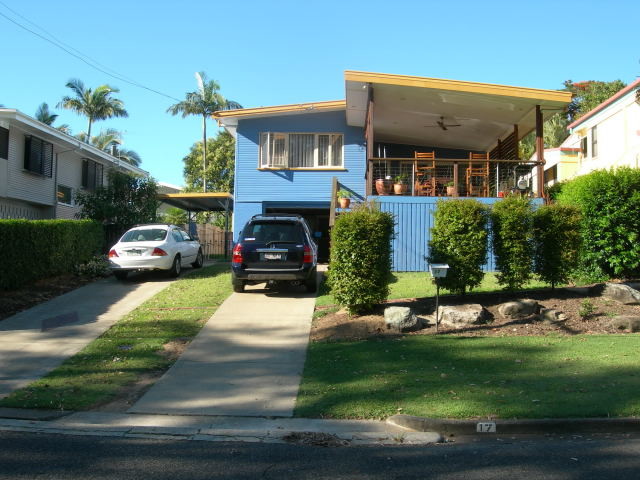 Beach style blue two-story wood gable roof photo in Brisbane