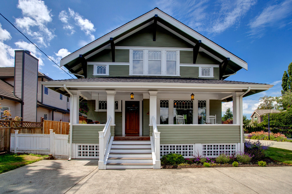 Inspiration for a craftsman green two-story exterior home remodel in Seattle