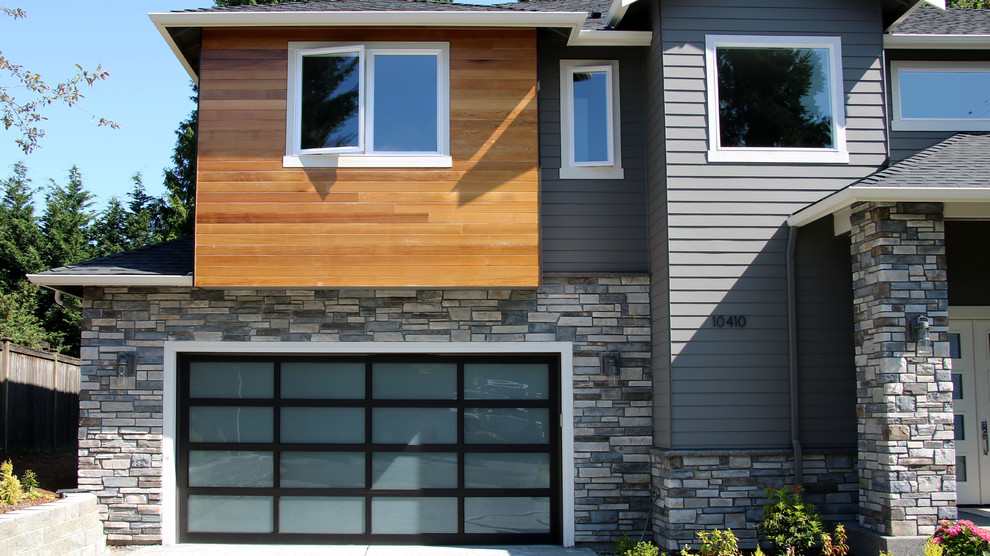 Gey traditional two floor detached house in Seattle with stone cladding.