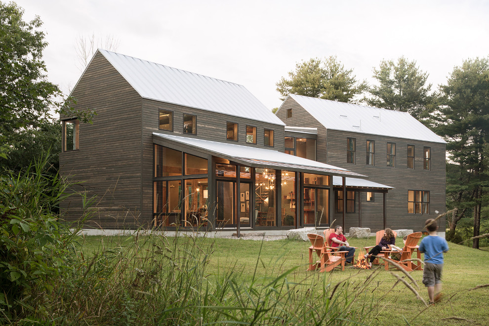 Inspiration for a brown rural detached house in Portland Maine with wood cladding, a pitched roof and a metal roof.
