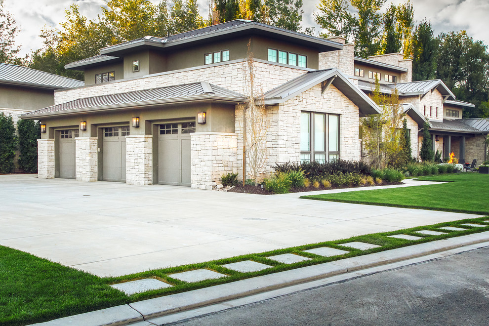 Photo of a large contemporary front yard concrete paver landscaping in Salt Lake City.