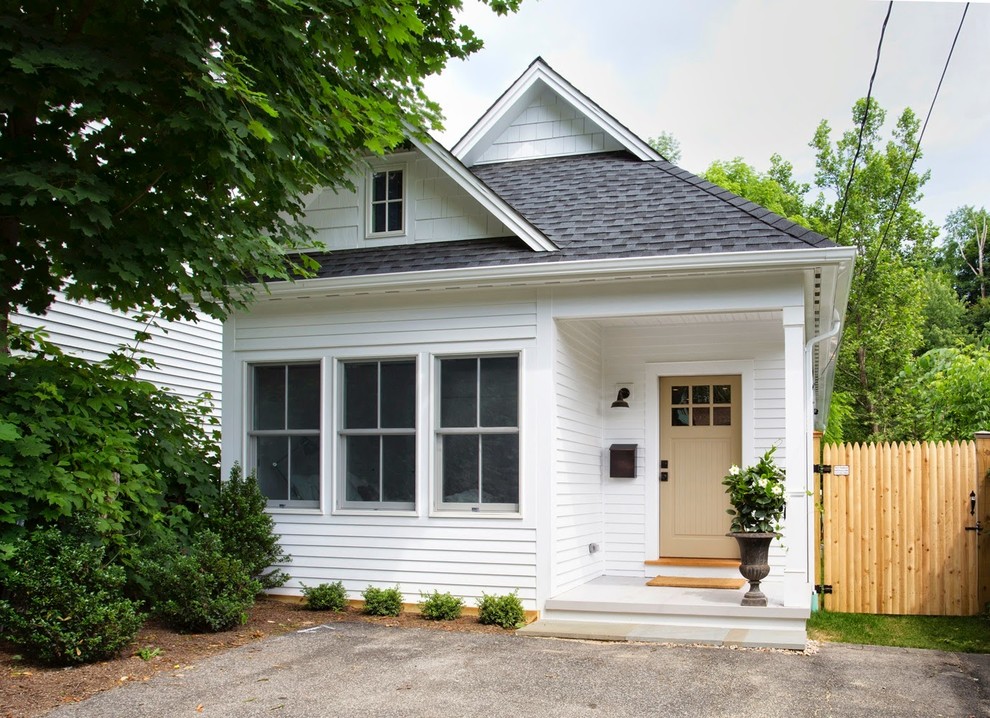 Example of a small classic white two-story wood house exterior design in Boston with a shingle roof