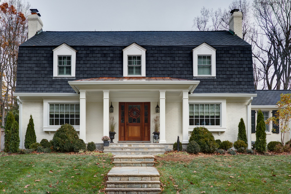 Inspiration for a transitional white two-story brick exterior home remodel in DC Metro
