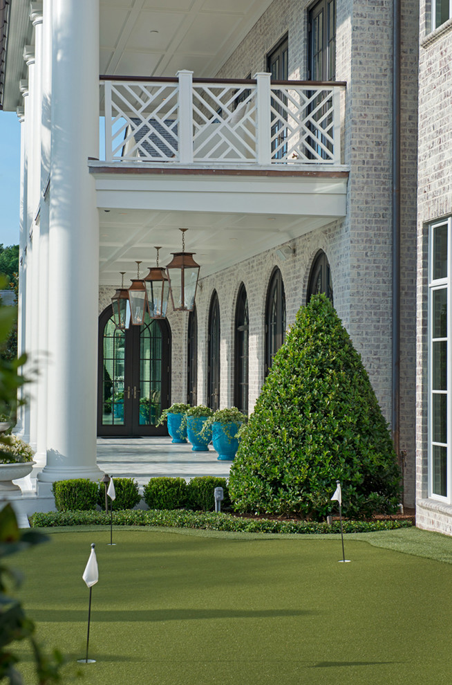 Inspiration for an expansive and white two floor brick house exterior in New Orleans.