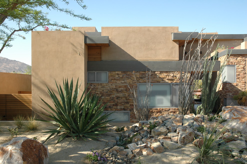 Example of a minimalist stone exterior home design in Los Angeles