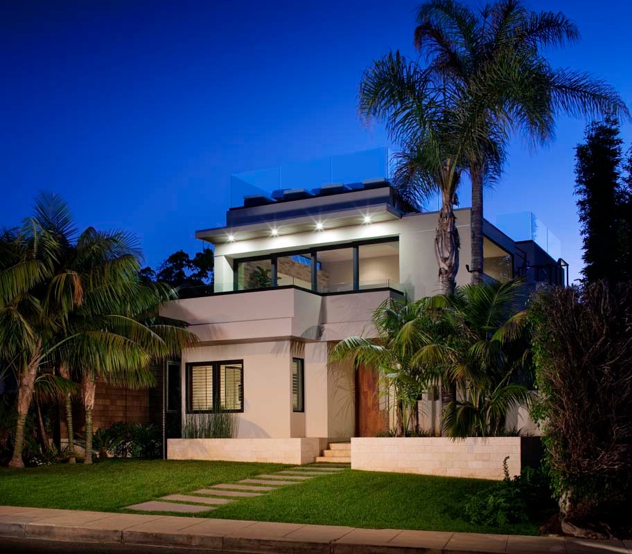 Example of a large minimalist white two-story concrete flat roof design in San Diego