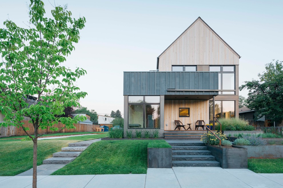 Small contemporary beige two-story wood exterior home idea in Other