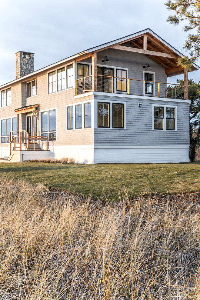 Large modern gray two-story wood house exterior idea in Portland Maine