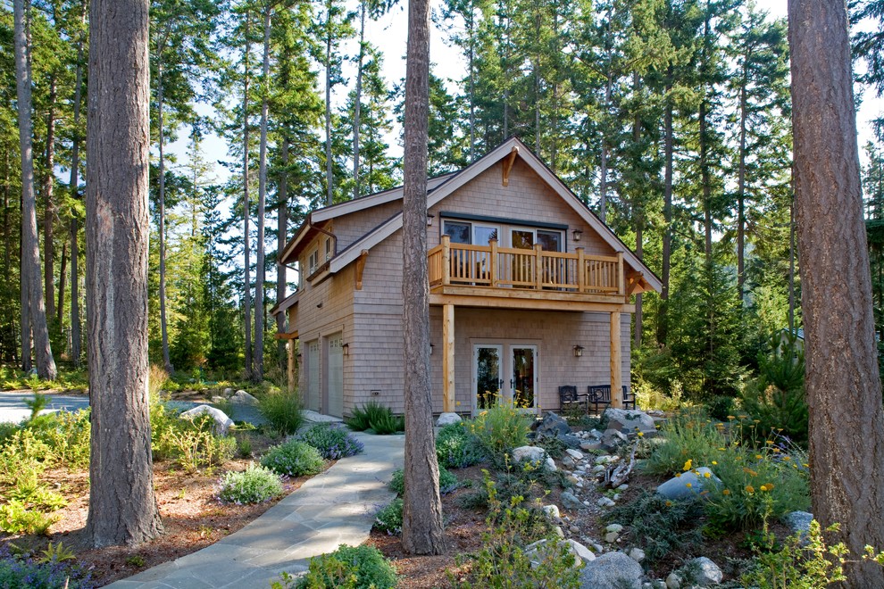 Inspiration for a rustic beige two-story wood exterior home remodel in Seattle with a shingle roof