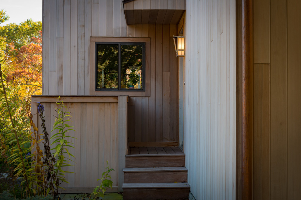 Example of a minimalist wood house exterior design in Bridgeport