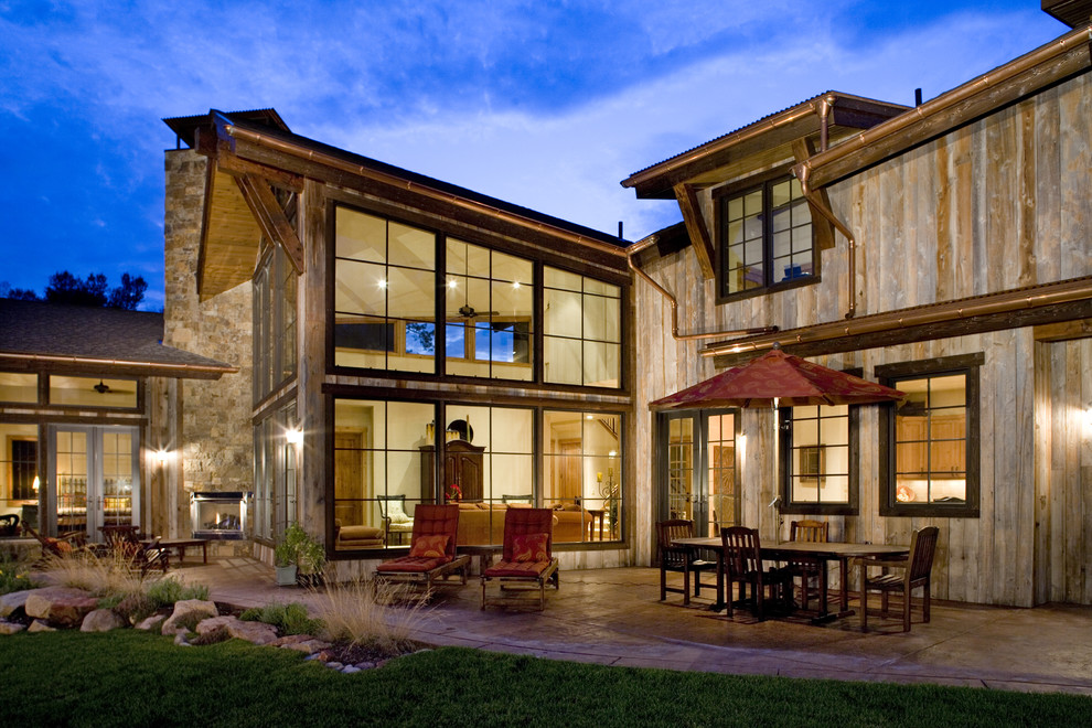 Inspiration for a rustic wood exterior home remodel in Denver