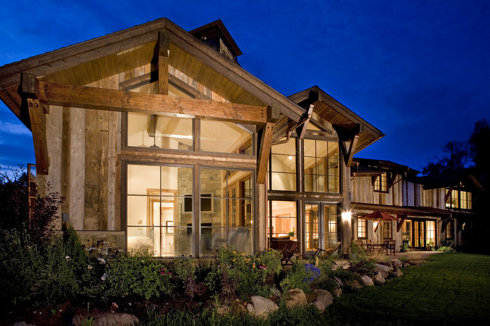Large rustic two floor house exterior in Denver with wood cladding.