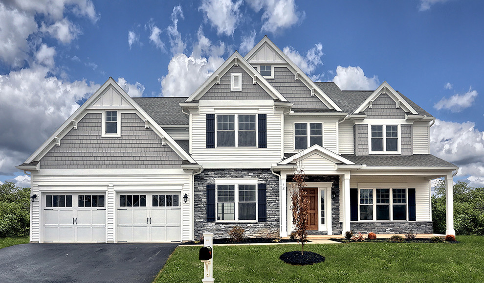 Large transitional gray two-story vinyl exterior home photo in Other with a shingle roof
