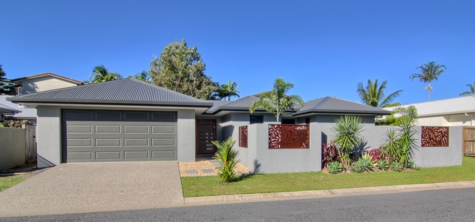 Design ideas for a medium sized and gey contemporary bungalow house exterior in Cairns with a hip roof.