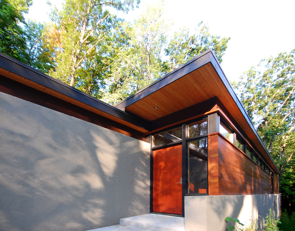 Inspiration for a large modern multicolored mixed siding house exterior remodel in Milwaukee