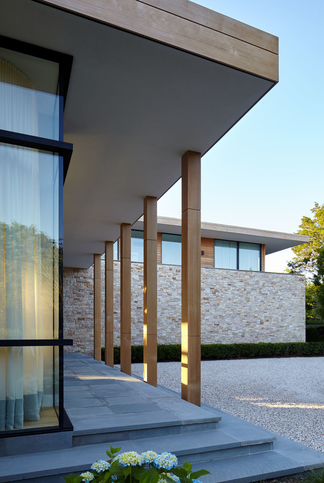 Inspiration for a large and beige modern two floor detached house in New York with mixed cladding, a flat roof and a mixed material roof.